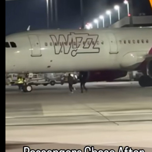 Doi români aleargă pe pista aeroportului din Köln după ce au ratat zborul spre București